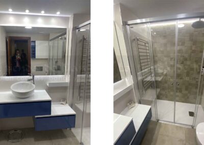 Aseo, Baño DiGiovanni, Reforma, Zaragoza, Baño, Mueble a medida, amueblamiento, mueble blanco, lavabo sobre encimera, tirador oculto, mueble cajones, durian, corian, krion, encimera madera, mampara cristal, cerámica mosaico, cerámica crema, cerámica lineas, suelo gris, radiador toallero, columna ducha, plato ducha pizarra, plato ducha a ras, toallero en alto, mampara de dos hojas, bañera, espejo luz led, mampara bañera